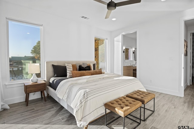 bedroom with connected bathroom and ceiling fan