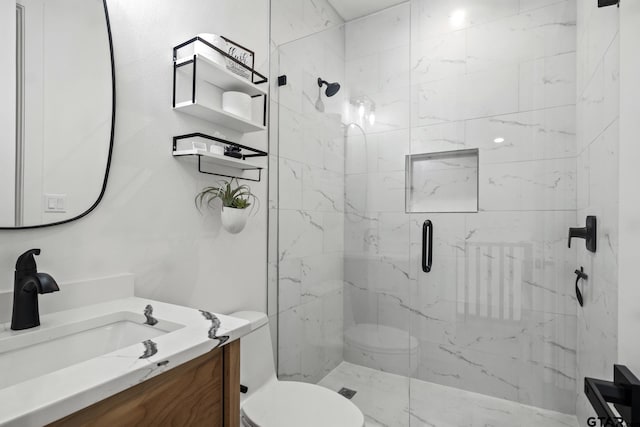 bathroom featuring vanity, toilet, and an enclosed shower