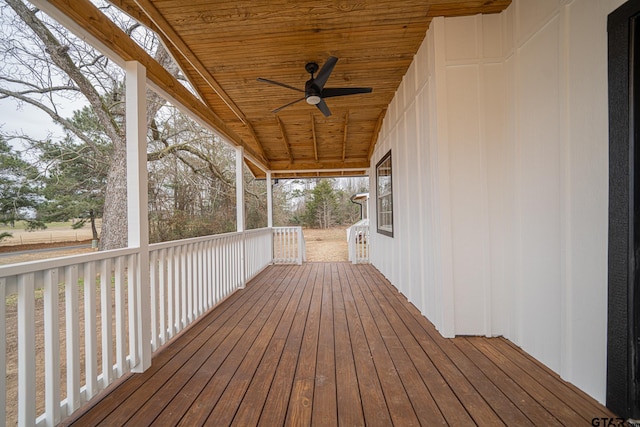 wooden terrace featuring ceiling fan