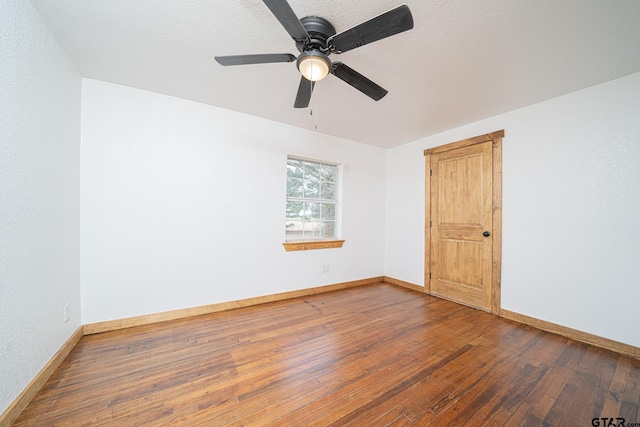 unfurnished room with wood-type flooring, a textured ceiling, and ceiling fan