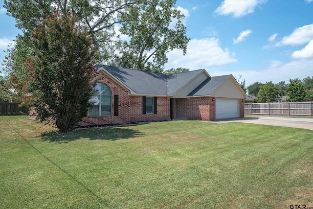 view of front of house with a garage and a front lawn