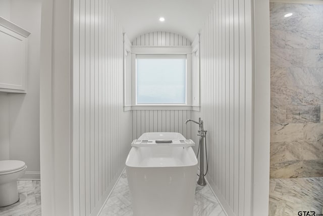 3116 Forest Ridge Cv, Tyler, TX 75703 - bathroom featuring marble tiled floors, toilet, and a tile shower