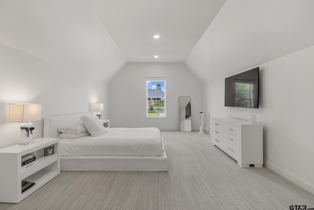 3116 Forest Ridge Cv, Tyler, TX 75703 - bedroom with vaulted ceiling, light colored carpet, and baseboards