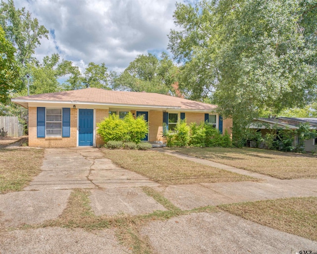 ranch-style house with a front lawn