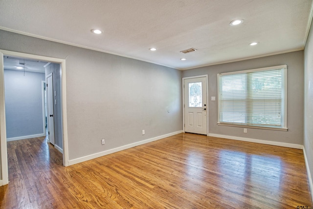 interior space featuring wood-type flooring and a textured ceiling