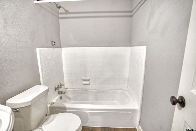 bathroom featuring hardwood / wood-style flooring and toilet