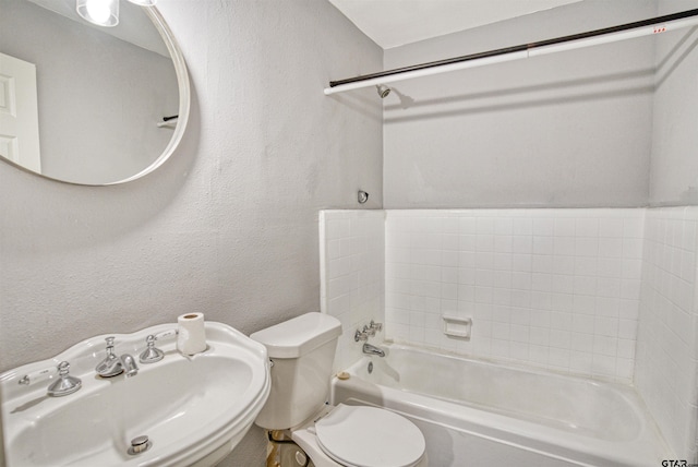 full bathroom with toilet, sink, and shower / washtub combination