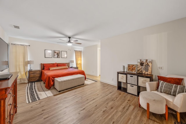 bedroom featuring ceiling fan and light hardwood / wood-style flooring