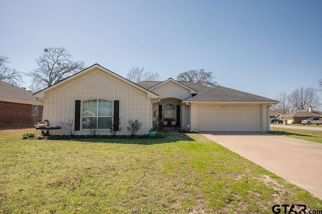 single story home with a front yard, an attached garage, a shingled roof, concrete driveway, and brick siding