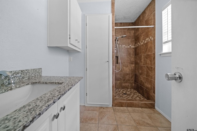 17607 Kristopher Cir, Whitehouse, TX 75791 - full bath featuring tiled shower, vanity, and tile patterned floors