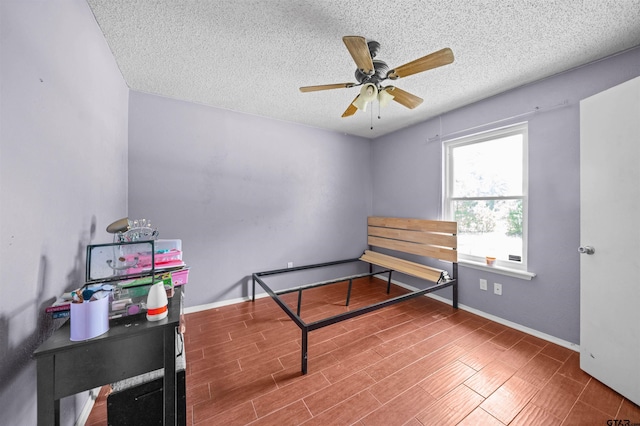 17607 Kristopher Cir, Whitehouse, TX 75791 - bedroom with a textured ceiling and a ceiling fan
