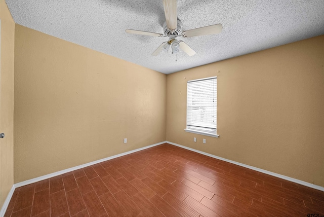 17607 Kristopher Cir, Whitehouse, TX 75791 - unfurnished room with a textured ceiling, ceiling fan, and dark wood-type flooring