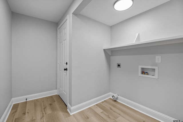 clothes washing area featuring hookup for an electric dryer, hookup for a washing machine, and hardwood / wood-style floors