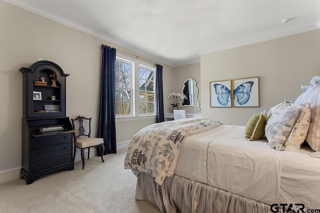 carpeted bedroom with baseboards and crown molding