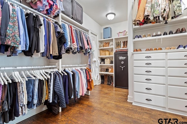 walk in closet featuring wood finished floors