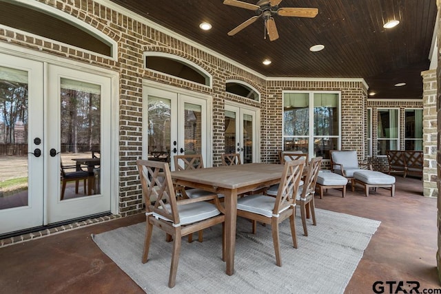 view of patio / terrace featuring french doors, ceiling fan, and outdoor dining area