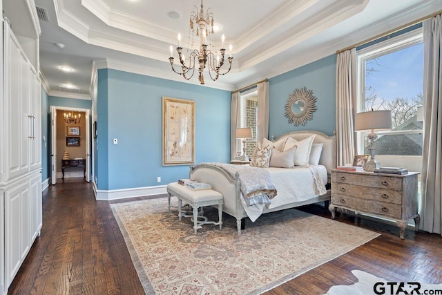 bedroom with a chandelier, visible vents, a raised ceiling, and dark wood finished floors