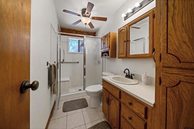 225 Springwood Cir, Chandler, TX 75758 - bathroom with vanity, tile patterned floors, a shower stall, and a ceiling fan