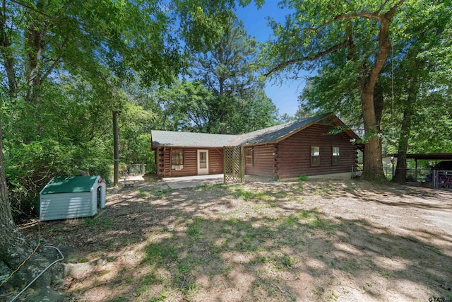 225 Springwood Cir, Chandler, TX 75758 - back of house featuring log exterior