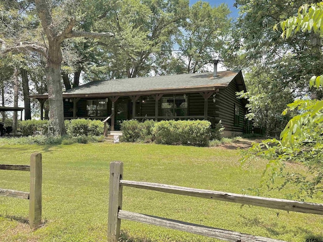225 Springwood Cir, Chandler, TX 75758 - view of front of house featuring log siding and a porch