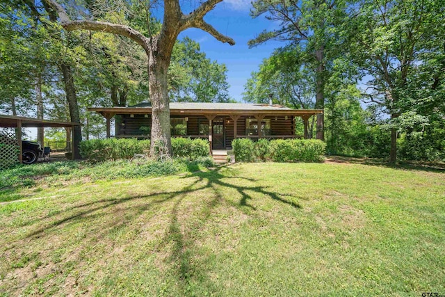 225 Springwood Cir, Chandler, TX 75758 - view of grassy yard featuring covered porch