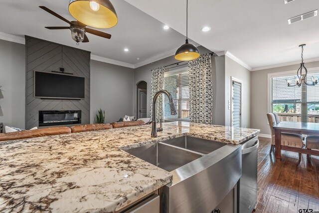 204 Providence Pl, Bullard, TX 75757 - kitchen featuring a sink, arched walkways, a ceiling fan, dark wood finished floors, and a chandelier