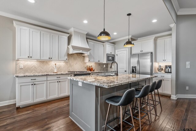 204 Providence Pl, Bullard, TX 75757 - kitchen with stainless steel appliances, custom range hood, dark wood-type flooring, tasteful backsplash, and crown molding