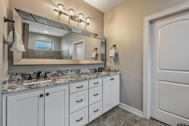 204 Providence Pl, Bullard, TX 75757 - bathroom featuring double vanity, marble finish flooring, and baseboards