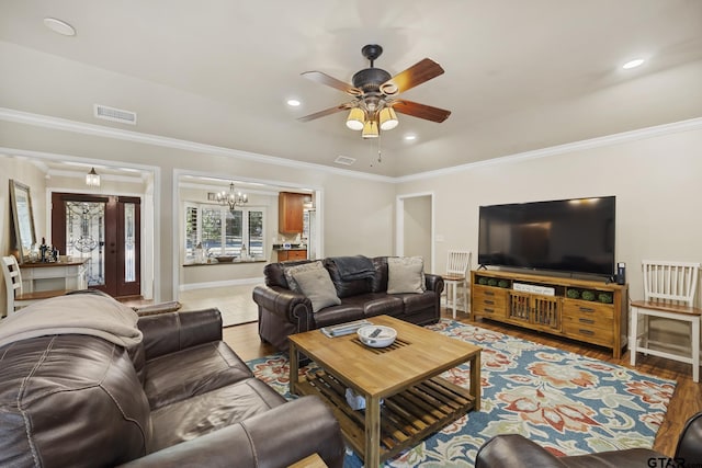 5298 Leaning Oaks Dr, Flint, TX 75762 - living room featuring a ceiling fan, a chandelier, ornamental molding, wood finished floors, and recessed lighting