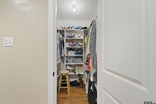 5298 Leaning Oaks Dr, Flint, TX 75762 - walk in closet with wood finished floors