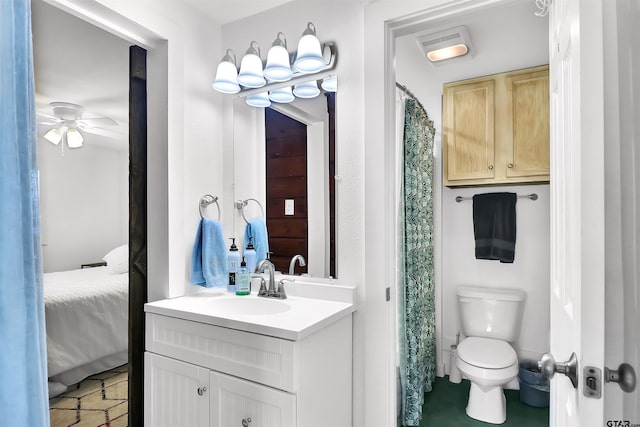 bathroom featuring ceiling fan, vanity, and toilet