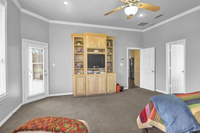 interior space with ornamental molding, dark colored carpet, and ceiling fan