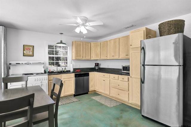 kitchen with sink, light brown cabinetry, stainless steel appliances, and pendant lighting