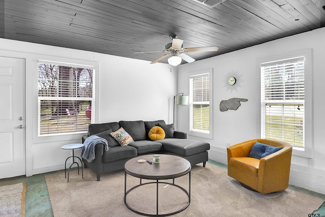 living room featuring light carpet, ceiling fan, and wood ceiling