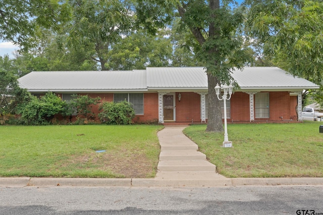 single story home featuring a front lawn and a porch