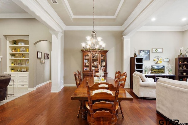 302 Coventry St, Bullard, TX 75757 - dining area with ornate columns, dark wood finished floors, a chandelier, crown molding, and arched walkways