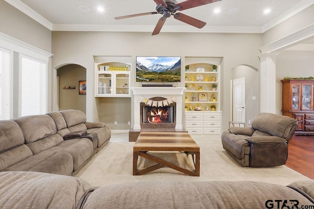 302 Coventry St, Bullard, TX 75757 - living room featuring arched walkways, ceiling fan, crown molding, a lit fireplace, and recessed lighting