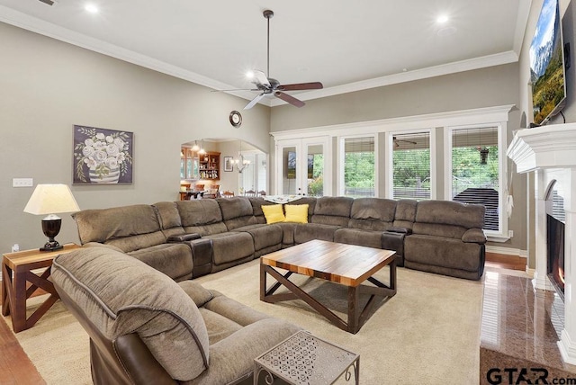 302 Coventry St, Bullard, TX 75757 - living area featuring arched walkways, a lit fireplace, ornamental molding, a ceiling fan, and recessed lighting
