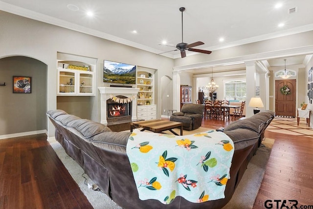 302 Coventry St, Bullard, TX 75757 - living room with decorative columns, hardwood / wood-style floors, a ceiling fan, recessed lighting, and a lit fireplace