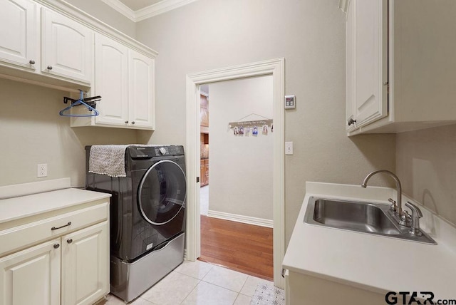 302 Coventry St, Bullard, TX 75757 - laundry room featuring cabinet space, washer / dryer, crown molding, and light tile patterned floors