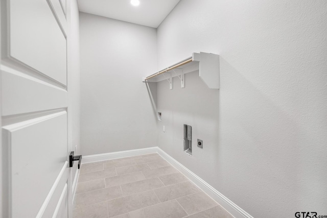 2062 County Road 1612, Alba, TX 75410 - clothes washing area with electric dryer hookup, hookup for a gas dryer, baseboards, recessed lighting, and light tile patterned floors