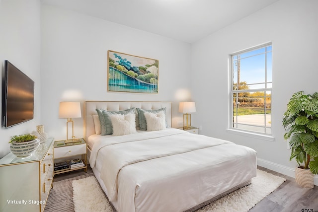 2062 County Road 1612, Alba, TX 75410 - bedroom featuring wood finished floors and baseboards