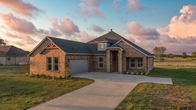 2062 County Road 1612, Alba, TX 75410 - view of front of house with brick siding, driveway, a lawn, a garage, and a shingled roof