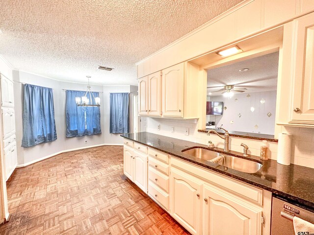 13909 Joe B Fulgham Cir, Brownsboro, TX 75756 - kitchen with a sink, a textured ceiling, dishwashing machine, a ceiling fan, and a chandelier
