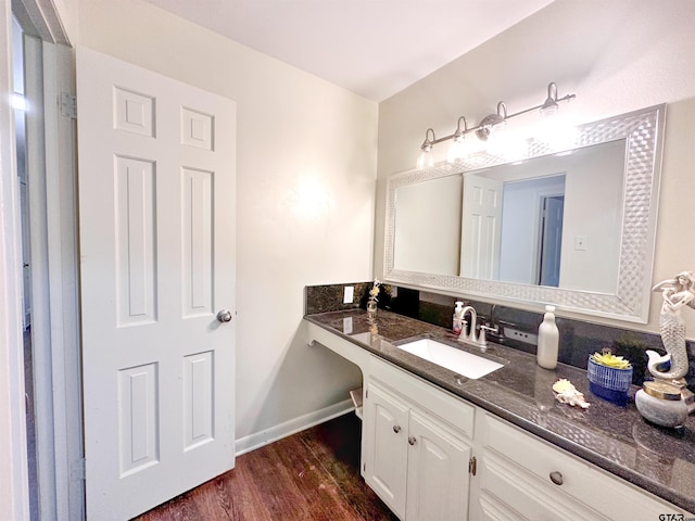 13909 Joe B Fulgham Cir, Brownsboro, TX 75756 - bathroom with wood finished floors, vanity, and baseboards