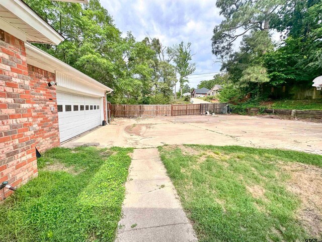 13909 Joe B Fulgham Cir, Brownsboro, TX 75756 - view of yard featuring fence and a garage