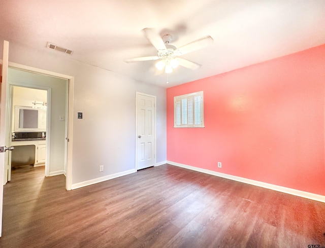 13909 Joe B Fulgham Cir, Brownsboro, TX 75756 - unfurnished bedroom with dark wood-style floors, baseboards, and a ceiling fan