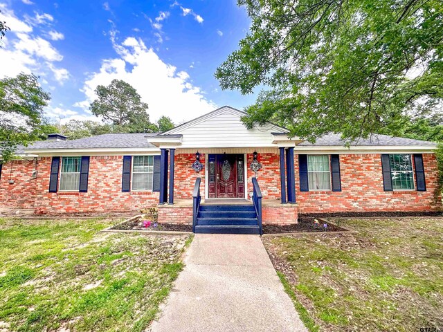 13909 Joe B Fulgham Cir, Brownsboro, TX 75756 - view of front facade featuring brick siding and a porch