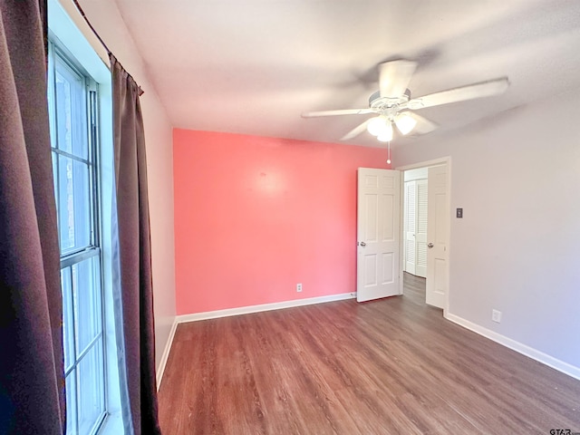 13909 Joe B Fulgham Cir, Brownsboro, TX 75756 - empty room featuring wood finished floors, ceiling fan, and baseboards