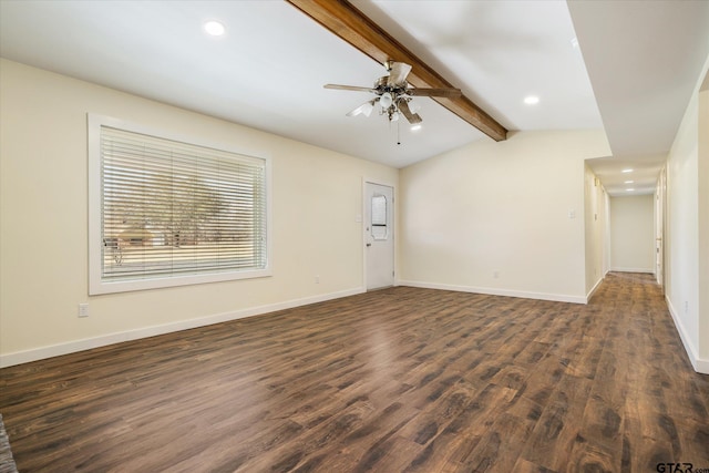 empty room featuring ceiling fan, dark wood-type flooring, and lofted ceiling with beams